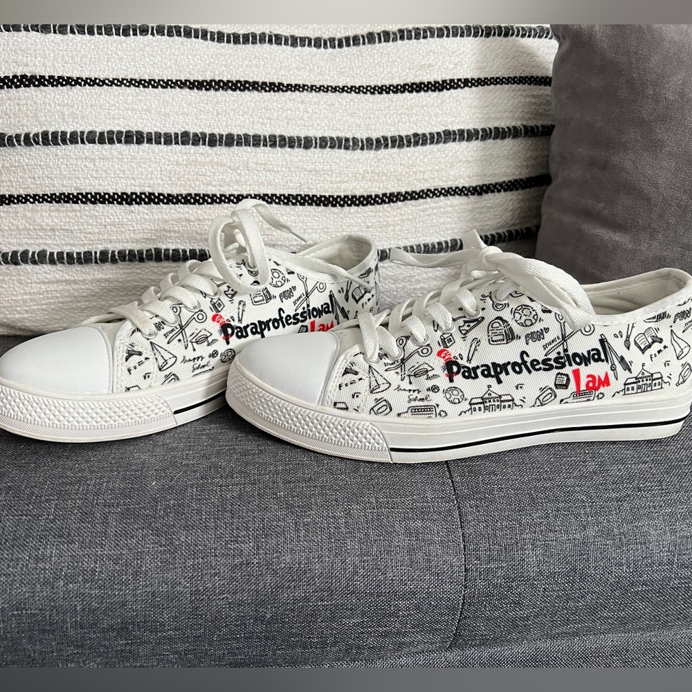 White tie sneakers decorated with Paraprofessional things